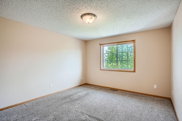 16786 Embers Ave, Lakeville, MN 55024 - unfurnished room featuring carpet flooring, a textured ceiling, and baseboards