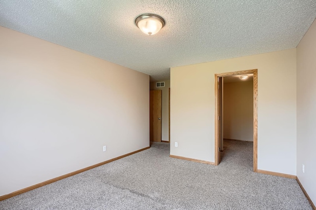 16786 Embers Ave, Lakeville, MN 55024 - unfurnished bedroom with carpet flooring, a textured ceiling, and baseboards