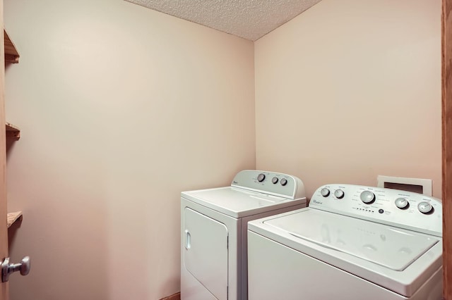 16786 Embers Ave, Lakeville, MN 55024 - clothes washing area featuring washer and clothes dryer and a textured ceiling