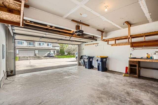 16786 Embers Ave, Lakeville, MN 55024 - garage with a garage door opener and a workshop area