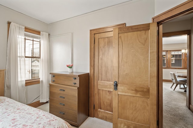 carpeted bedroom with baseboards