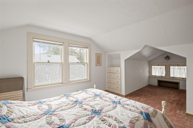 carpeted bedroom with vaulted ceiling