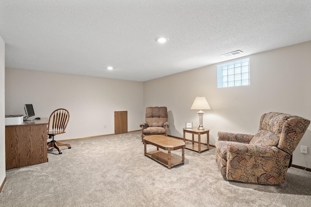 interior space with baseboards, visible vents, carpet floors, and a textured ceiling