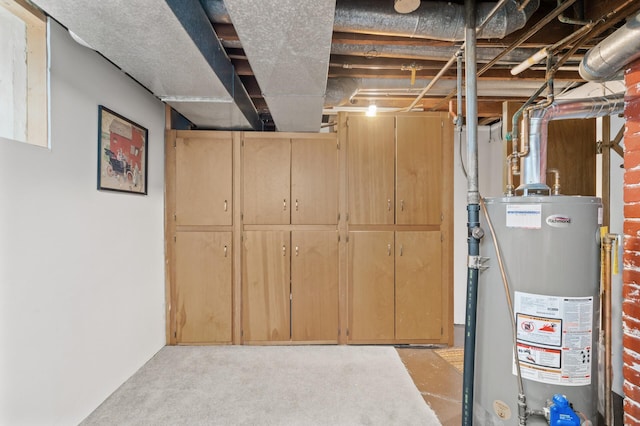 unfinished basement featuring gas water heater