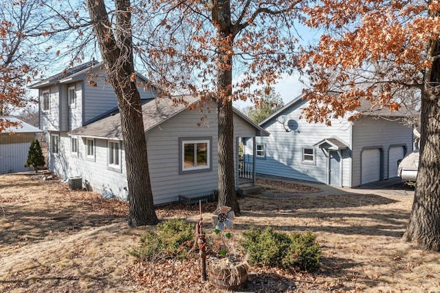 28510 142nd St NW, Zimmerman, MN 55398 - view of front of house with central AC and roof with shingles