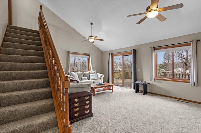 28510 142nd St NW, Zimmerman, MN 55398 - living room with a ceiling fan, carpet flooring, vaulted ceiling, stairway, and baseboards