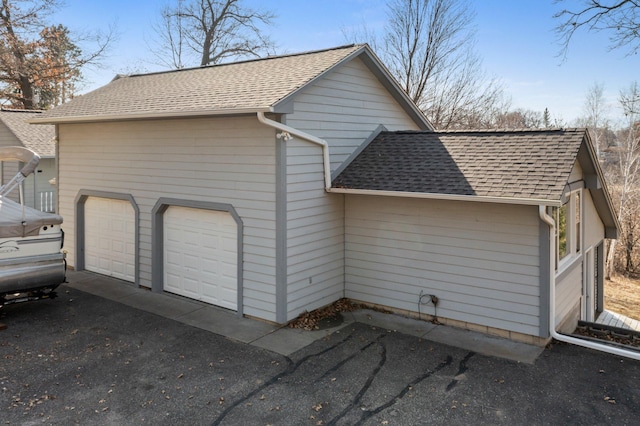 28510 142nd St NW, Zimmerman, MN 55398 - view of property exterior featuring roof with shingles and a garage
