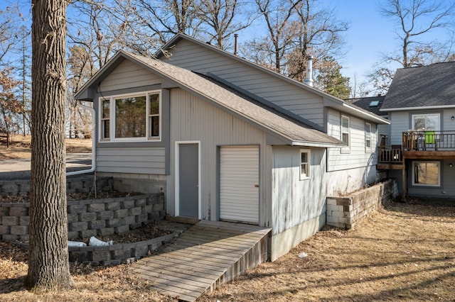28510 142nd St NW, Zimmerman, MN 55398 - view of side of property featuring a shingled roof and a deck