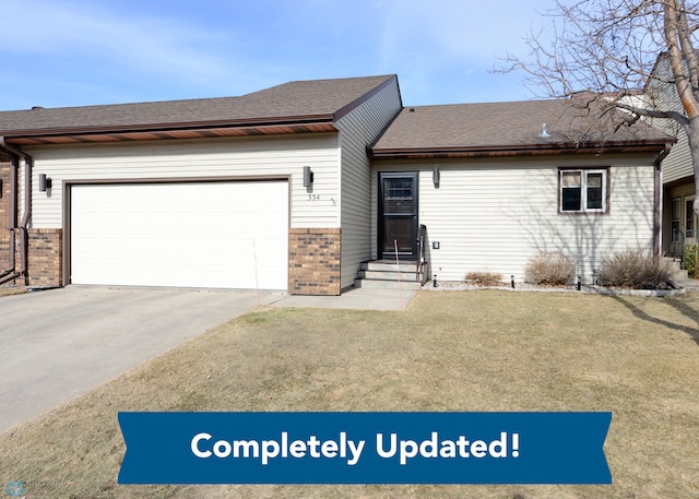 ranch-style house featuring brick siding, a front yard, roof with shingles, driveway, and an attached garage