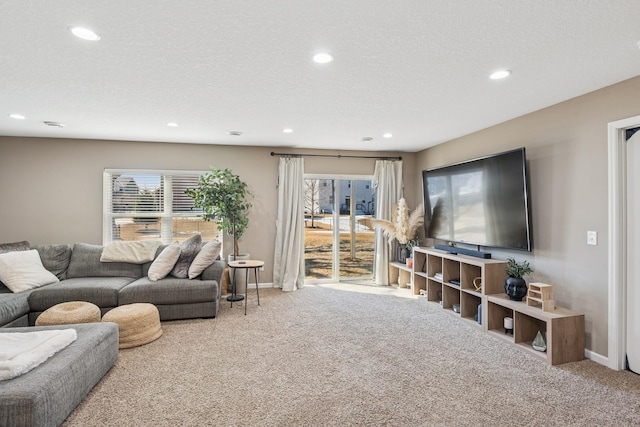 living room with recessed lighting, baseboards, carpet floors, and a textured ceiling