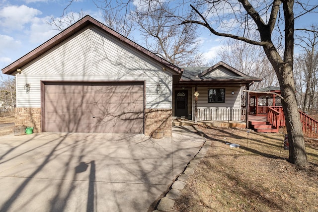 view of front of property with concrete driveway, an attached garage, and brick siding