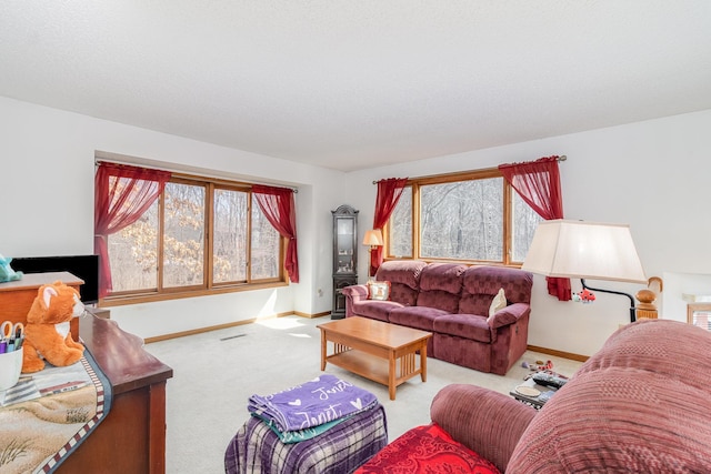 carpeted living room with baseboards