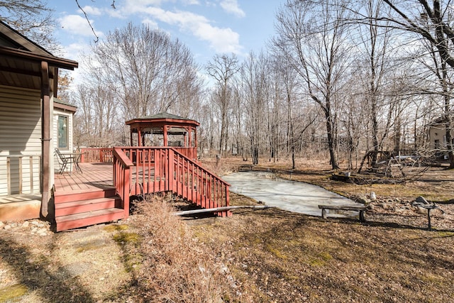 wooden terrace featuring a gazebo