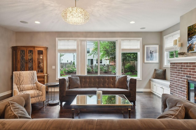 living room with recessed lighting, a fireplace, dark wood-style flooring, and baseboards