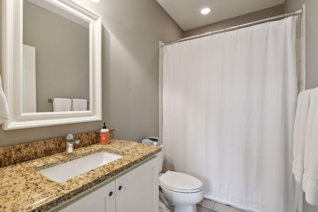 bathroom with recessed lighting, curtained shower, toilet, and vanity