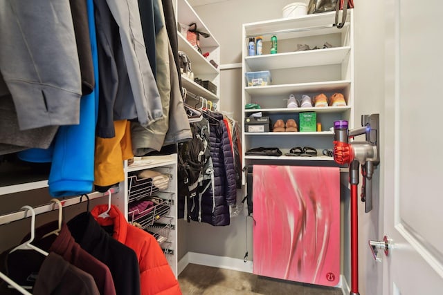 walk in closet with tile patterned flooring