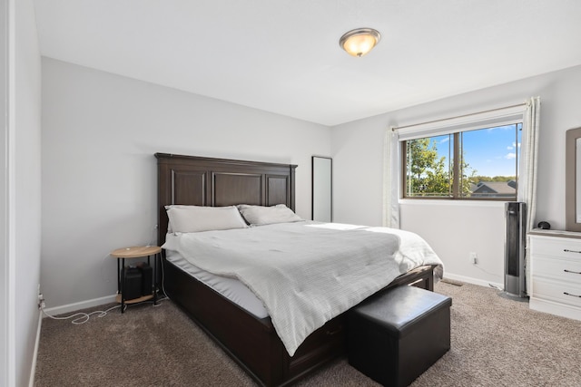 bedroom featuring baseboards and carpet floors