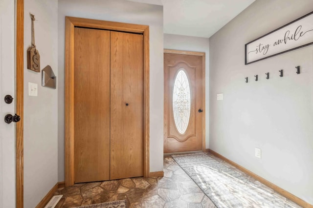 entryway with visible vents and baseboards