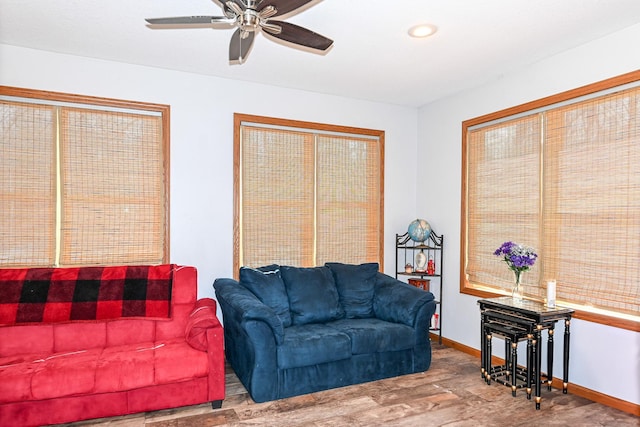 living area with recessed lighting, ceiling fan, baseboards, and wood finished floors