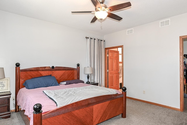 bedroom featuring visible vents, baseboards, carpet, and a ceiling fan