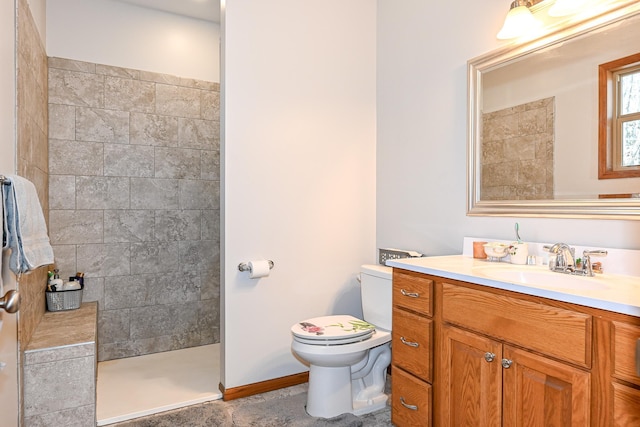 full bathroom with vanity, toilet, and a walk in shower