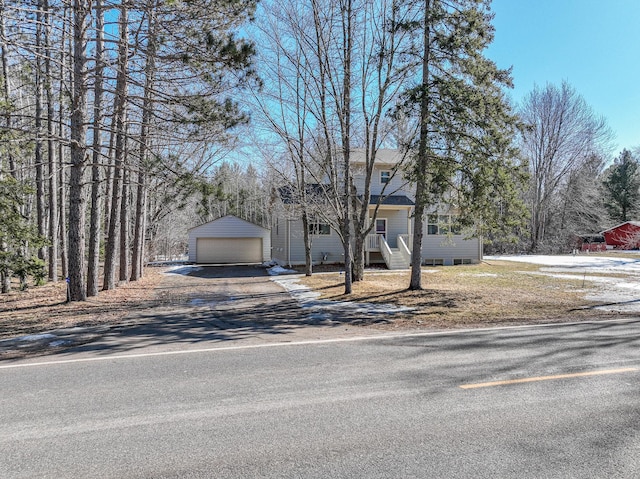 view of front of house featuring an outbuilding and a detached garage