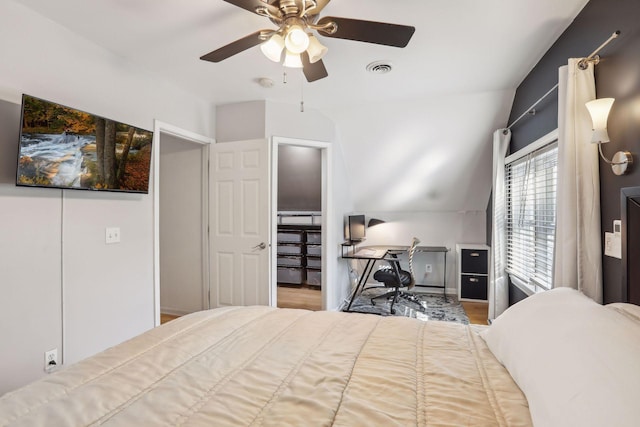 bedroom featuring visible vents, lofted ceiling, and ceiling fan