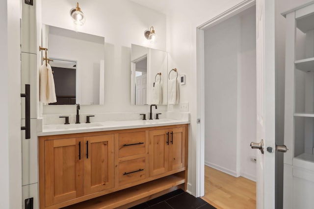 bathroom with double vanity and a sink