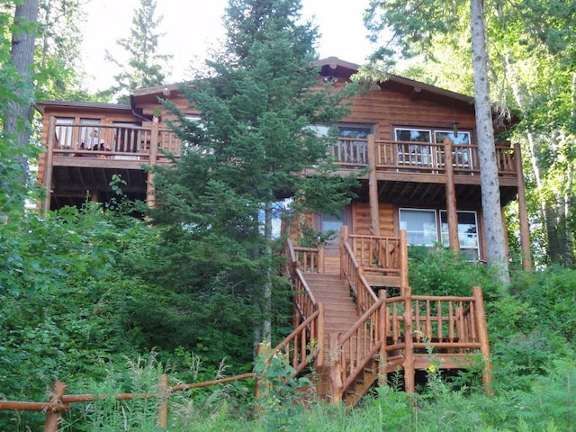 back of property with stairway