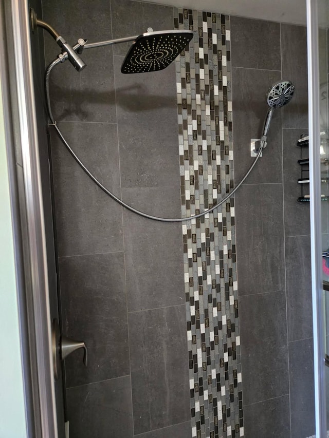 interior space featuring tiled shower