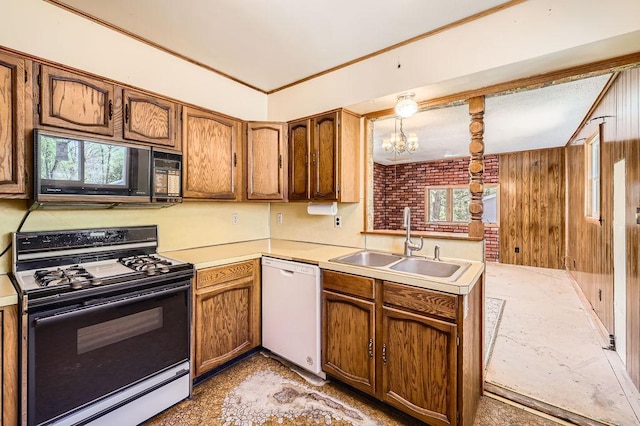 900 Park St, Anoka, MN 55303 - kitchen with black appliances, a sink, light countertops, and a chandelier