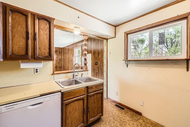 900 Park St, Anoka, MN 55303 - kitchen featuring dishwasher, a sink, plenty of natural light, light countertops, and crown molding