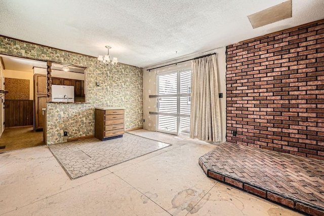 900 Park St, Anoka, MN 55303 - unfurnished bedroom featuring a textured ceiling, freestanding refrigerator, a chandelier, access to exterior, and a sink