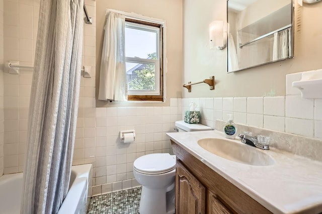 900 Park St, Anoka, MN 55303 - full bathroom featuring tile walls, toilet, tile patterned flooring, shower / bath combo, and a wainscoted wall
