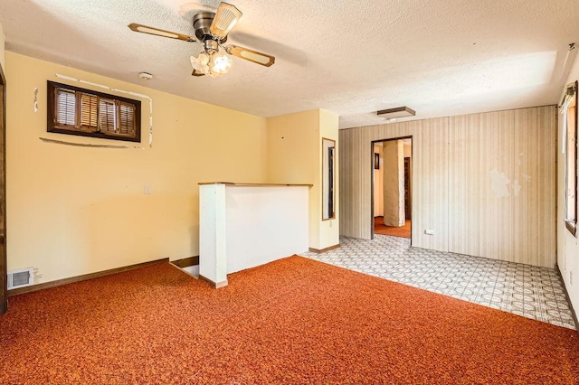 900 Park St, Anoka, MN 55303 - empty room with a textured ceiling, baseboards, and ceiling fan
