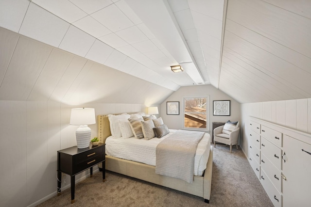 bedroom featuring lofted ceiling and carpet floors