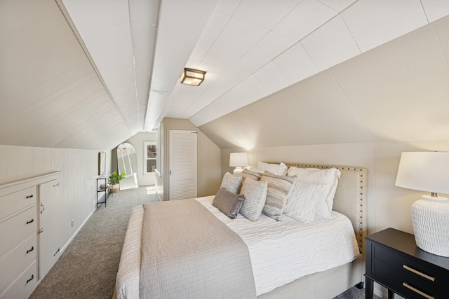 carpeted bedroom with lofted ceiling