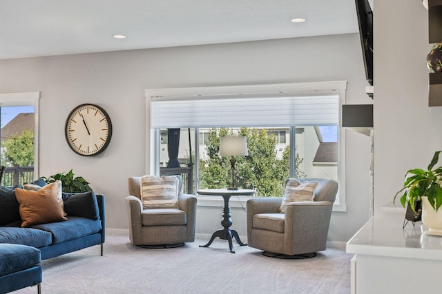 carpeted living room with recessed lighting and baseboards