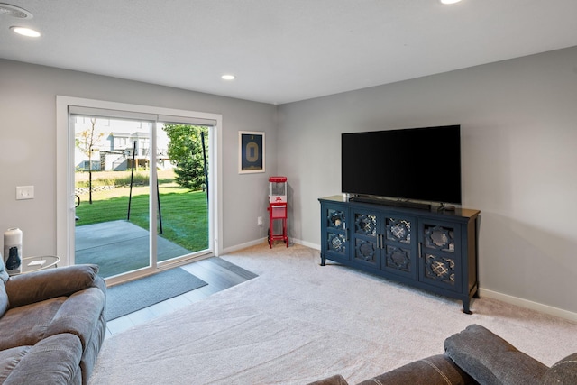 living area with recessed lighting, carpet, and baseboards