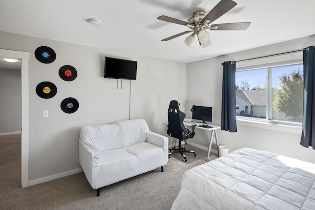 carpeted bedroom featuring a ceiling fan and baseboards