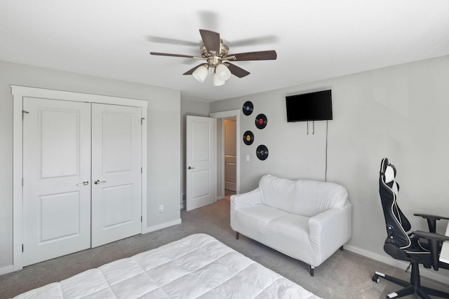 bedroom featuring a closet, ceiling fan, baseboards, and carpet floors