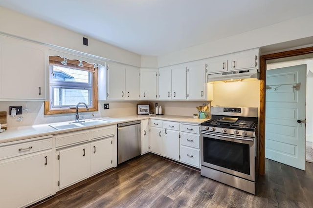 4250 32nd Ave S, Minneapolis, MN 55406 - kitchen featuring under cabinet range hood, appliances with stainless steel finishes, a sink, and dark wood-type flooring