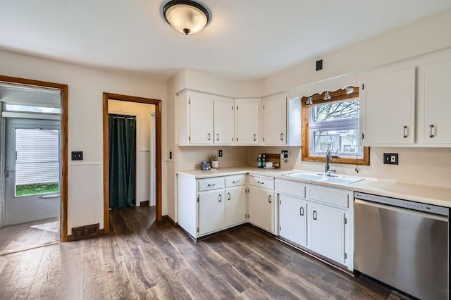 4250 32nd Ave S, Minneapolis, MN 55406 - kitchen featuring dark wood-type flooring, light countertops, white cabinetry, a sink, and dishwasher