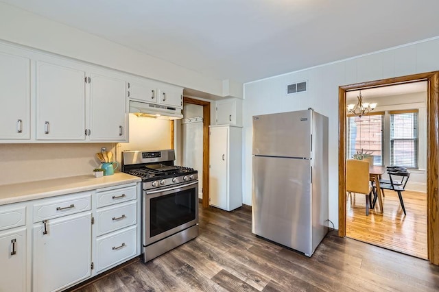 4250 32nd Ave S, Minneapolis, MN 55406 - kitchen featuring visible vents, dark wood-style flooring, under cabinet range hood, a chandelier, and stainless steel appliances