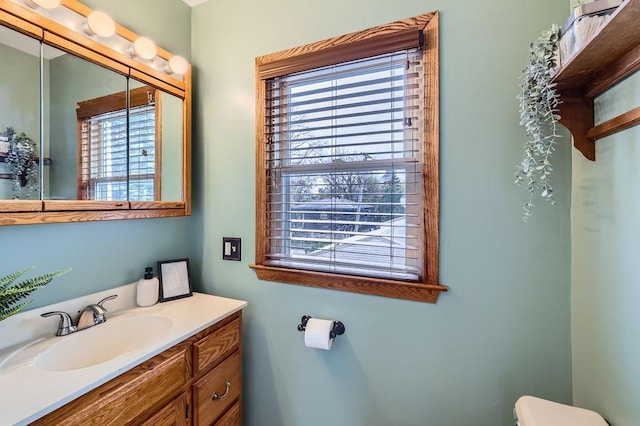 4250 32nd Ave S, Minneapolis, MN 55406 - bathroom featuring toilet, a healthy amount of sunlight, and vanity