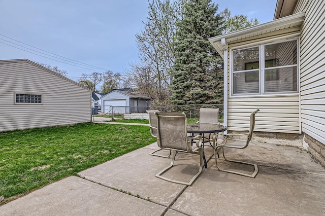 4250 32nd Ave S, Minneapolis, MN 55406 - view of patio / terrace with outdoor dining area, fence, and a detached garage