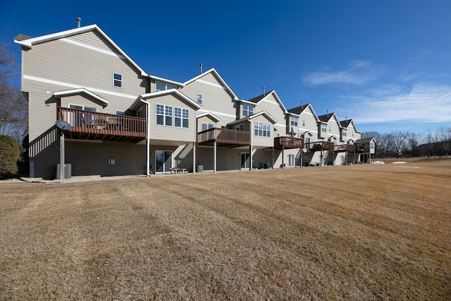 rear view of property featuring a deck