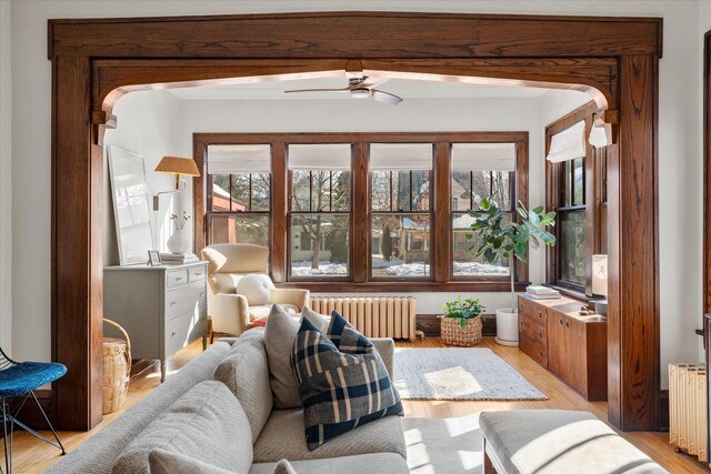 sunroom with radiator and ceiling fan