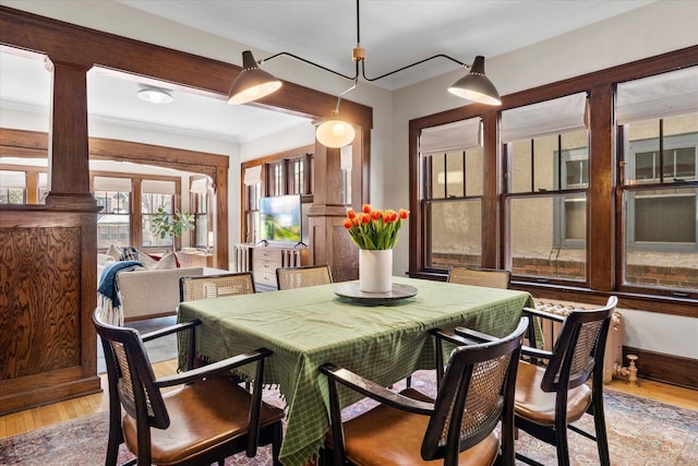 dining space featuring light wood finished floors