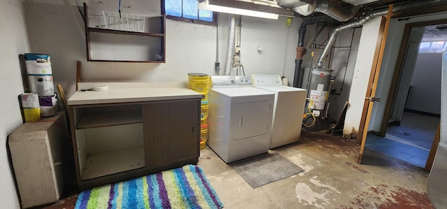 laundry area with a healthy amount of sunlight, washing machine and dryer, laundry area, and water heater